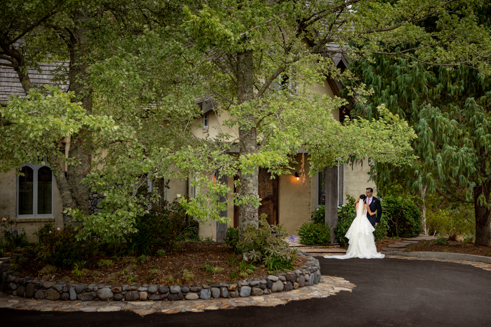 Bride and Groom in front of the French Country House