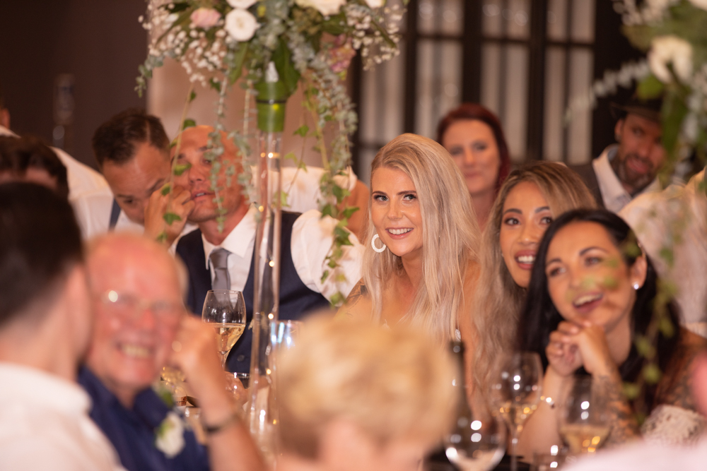 Bride laughing at her reception
